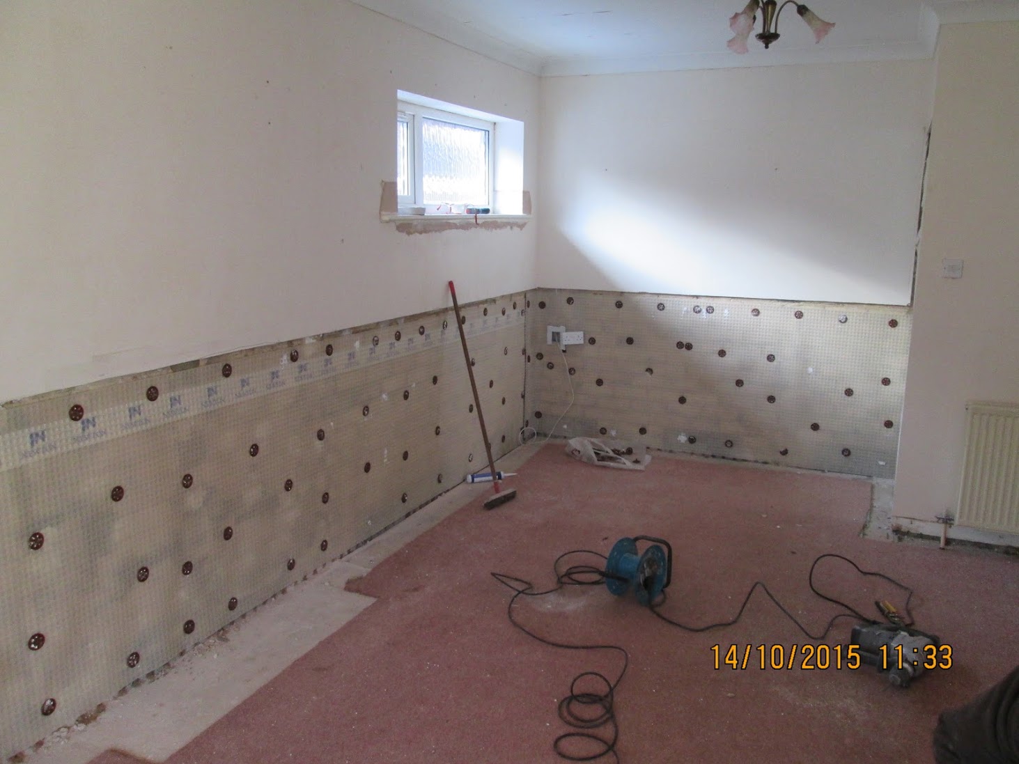 Damp-proof membrane lining a ground-floor wall