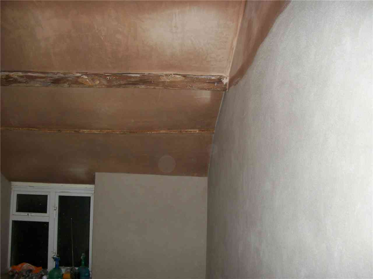 Lime plaster to a period ceiling and beam