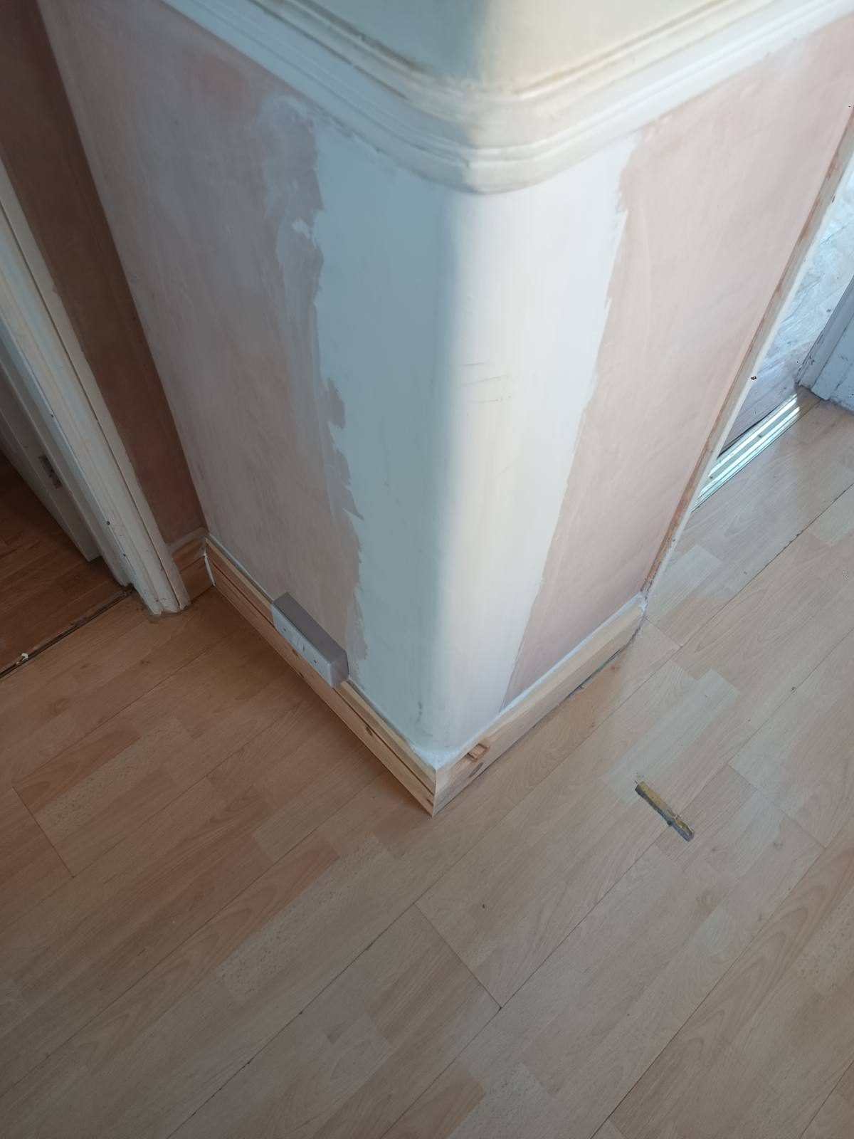 Fresh plaster taken neatly up to the original cornice