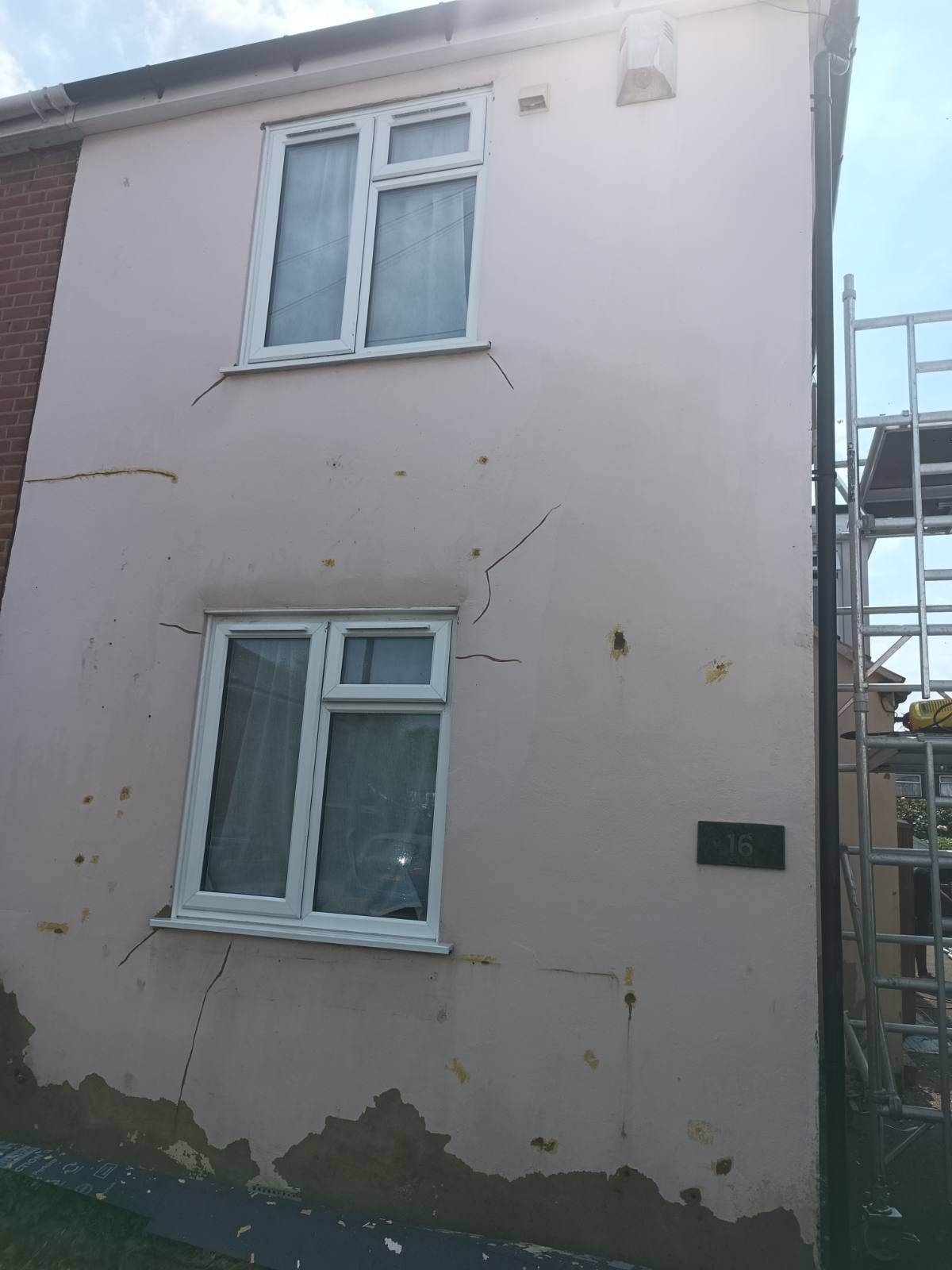 Before — Cracked, damp-stained elevation re-rendered
